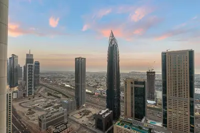 a view of a city with a tall skyscraper at Luxe 2BR Burj Vista Retreat, Steps from Dubai Mall & Burj Khalifa in Dubai