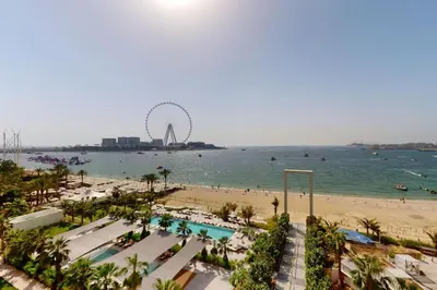 a view of the beach and the ferris wheel at La Vie JBR - Breathtaking Two Bedroom in Dubai
