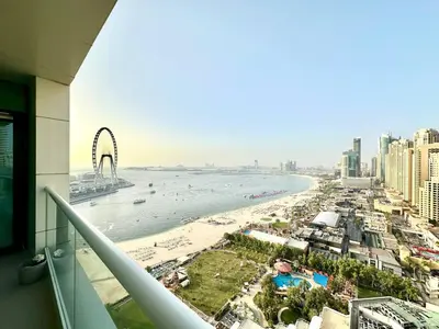 a view of a beach and the ocean from a building at 1BR Apartment, Full Sea and JBR View in Dubai