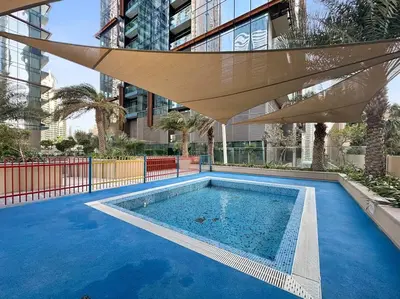a swimming pool in the middle of a building at Luxury 2BR with Marina Views Near Dining Shopping Attractions & Beaches in Dubai