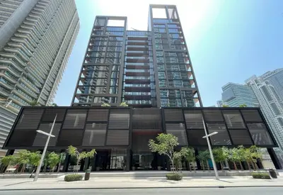a large building with two tall buildings in a city at Modern Studio Downtown DT1, Walk to Dubai Mall, Burj View & Metro in Dubai