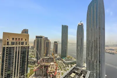 an aerial view of a city with tall buildings at Luxury Living with Panoramic View in Creek Harbour in Dubai