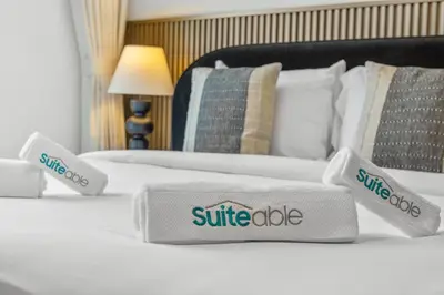 two beds in a hotel room with white sheets and pillows at Luxury Living with Panoramic View in Creek Harbour in Dubai