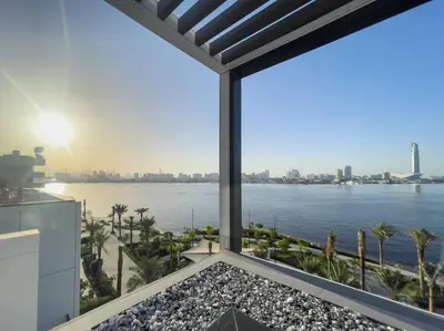 a view of the water from a house at Luxury Living with Panoramic View in Creek Harbour in Dubai