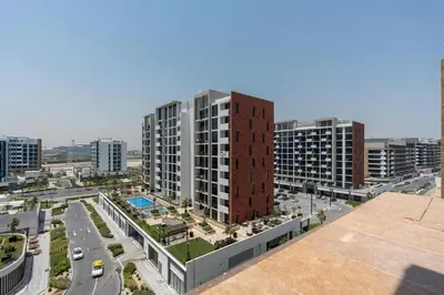an aerial view of a city with tall buildings at Studio - 12 min downtown - Pool - Azizi Riviera in Dubai