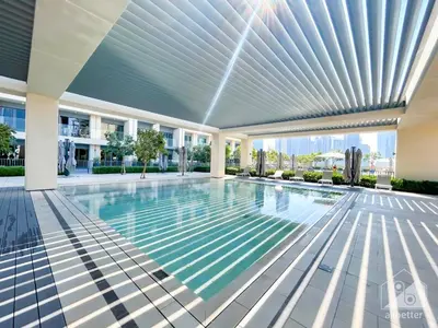 a swimming pool in the middle of a building at Prestigious Burj Royale luxury Apartments Downtown in Dubai