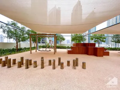a playground in a building with a swing at Prestigious Burj Royale luxury Apartments Downtown in Dubai
