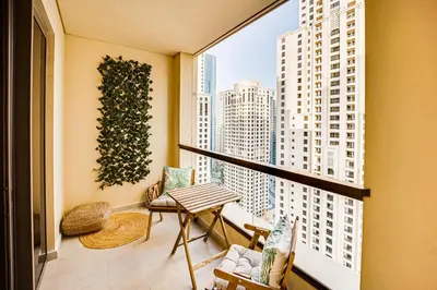 a balcony with a view of a city skyline at 2BD apartment near the beach in Bahar, JBR in Dubai