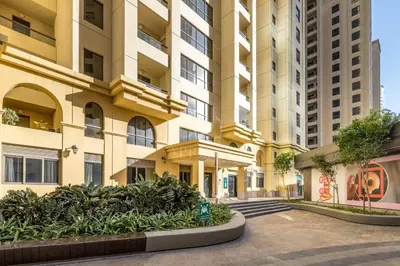 an empty street in front of a tall building at 2BD apartment near the beach in Bahar, JBR in Dubai