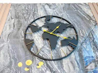 a clock that is sitting on top of tin foil at Elegance at Aziz Riviera Studio & Balcony in Dubai