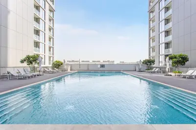 a swimming pool in the middle of a building at STAY BY LATINEM Luxury 1BR Holiday Home CV B803 near Burj Khalifa in Dubai