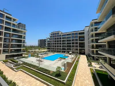 an aerial view of an apartment complex with a swimming pool at Luxurious New Brand 2Br at Mulberry 2 at Park Heights Building A2 - Dubai Hills in Dubai