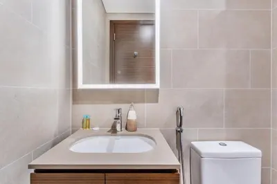 a bathroom with a sink and a toilet at STAY BY LATINEM Luxury 1BR Holiday Home CVR A609 near Burj Khalifa in Dubai