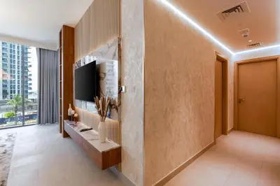 a hallway with a television in a building at GLOBALSTAY Creek Rise Tower Elegant Apartments in Dubai