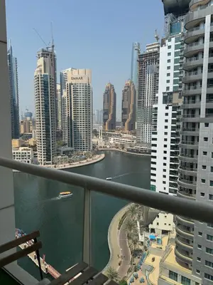 a view of a river in a city with buildings at Golden Hour Marina View in Dubai