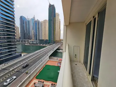 a view of a city from a balcony of a building at Golden Hour Marina View in Dubai