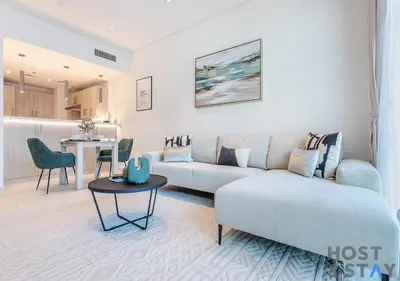 a living room with a couch and a table at Luxurious 1BR Palm Seven, Palm Jumeirah in Dubai