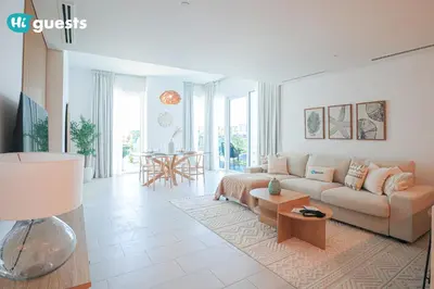 a living room with a couch and a table at HiGuests - Ocean Views and Comfort in La Vie, JBR in Dubai