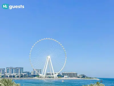 a large ferris wheel in the middle of the water at HiGuests - Ocean Views and Comfort in La Vie, JBR in Dubai