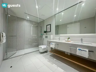 a bathroom with a sink and a shower and a toilet at HiGuests - Ocean Views and Comfort in La Vie, JBR in Dubai
