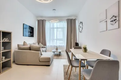a living room with a couch and a table at Stylish 2bd with great view in Marina View Tower in Dubai