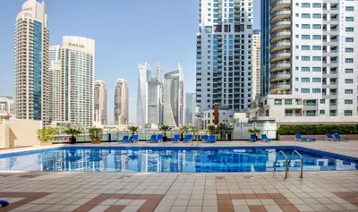 a swimming pool in a city with tall buildings at Stylish 2bd with great view in Marina View Tower in Dubai