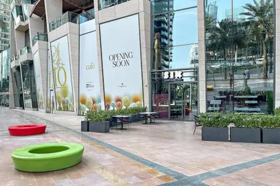 a large building with a green bowl in front of it at Luxe 3BR Retreat, Balcony Burj & Fountain Views, Prime Downtown Stay in Dubai