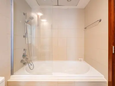 a bathroom with a tub and a shower at Downtown Luxury Living -1BR-Standpoint Tower A in Dubai