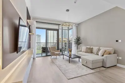 a living room with a couch and a table at Luxury 2 bedroom in Dubai Creek Harbour- Suiteable in Dubai