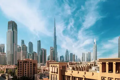 a view of a city with tall buildings at Iconic Burj Khalifa Views from Luxury 1BR Home in Dubai