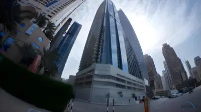 a tall building in a city with tall buildings at Charming 1BR in Damac Heights, Dubai Marina by Deluxe Holiday Homes in Dubai