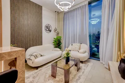 a living room with a couch and a table at Apartment 1015 Waves in Dubai