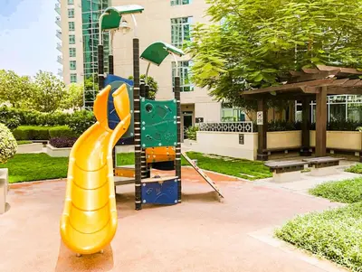 a playground with a slide in a park at Elite Royal Apartment - Sky Series - Breathtaking View - Full Burj Khalifa & Fountain in Dubai