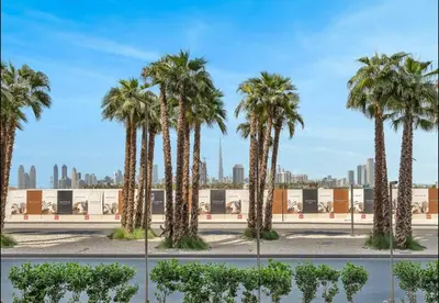 a group of palm trees in a park at AWS Holiday Homes - Chic Downtown Views in Dubai