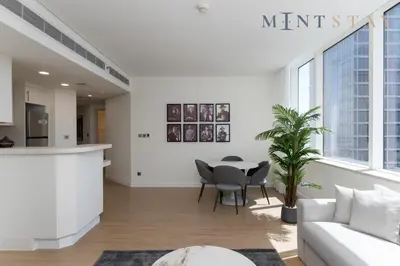 a living room with a couch and a table at Sky Gardens, Park Avenue, DIFC - Mint Stay in Dubai