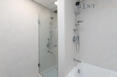a bathroom with a shower and a sink and a toilet at Sky Gardens, Park Avenue, DIFC - Mint Stay in Dubai