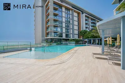 a swimming pool with a skateboard in front of a building at Mira Holiday Homes - Lovely 3 bedroom in Bluewaters with sea view in Dubai