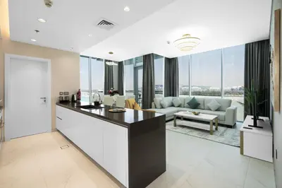 an open kitchen and living room with a view at Your Keys Holiday Homes in Dubai