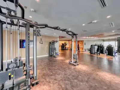 a gym with a fitness room with machines at Premium 2 BDR Burj Khalifa Infinity Pool View in Dubai