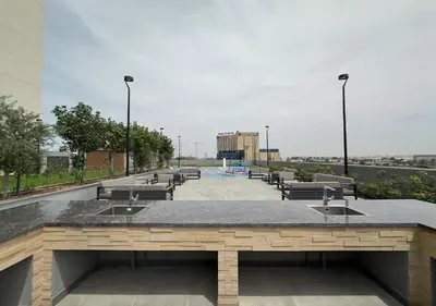 a row of sinks and benches in a parking lot at Extraordinary 2BR in Prive Residence, Dubai Hills in Dubai