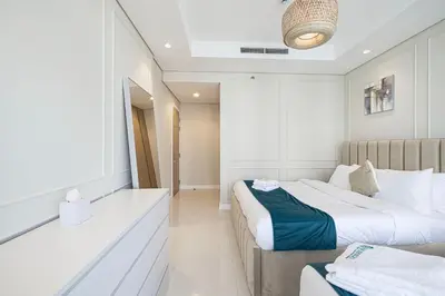 a hotel room with two beds at Boulevard 2 Bedroom Family Apartment with BURJ KHALIFA view and INFINITY POOL in 64th Floor Dubai Downtown in Dubai