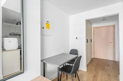 a dining room with a table and two chairs at Bright Downtown Dubai Studio by Mall, Burj Khalifa & Fountains in Dubai