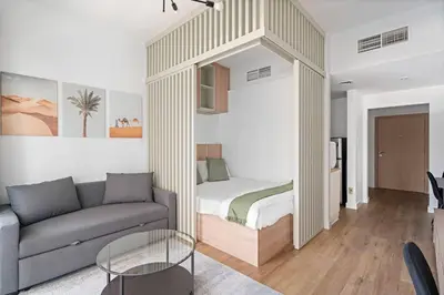 a living room with a bed and a couch at New Design Studio next to Burj Khalifa, Mall & Dubai Fountain in Dubai