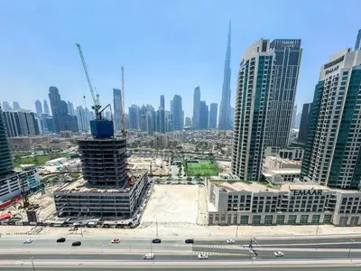 a view of a city with a building under construction at High Floor Burj Khalifa View 1BR - Business Bay in Dubai