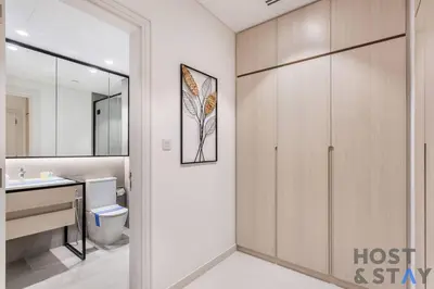 a bathroom with a toilet and a sink at Central 1BR Apartment at Wilton Park - Host & Stay in Dubai