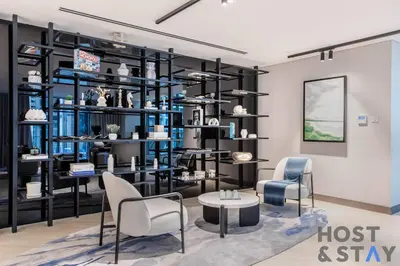 a store with blue and black shelving at Central 1BR Apartment at Wilton Park - Host & Stay in Dubai
