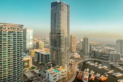 an aerial view of a city with a tall building at Prime Retreats - Sparkle Tower Marina in Dubai