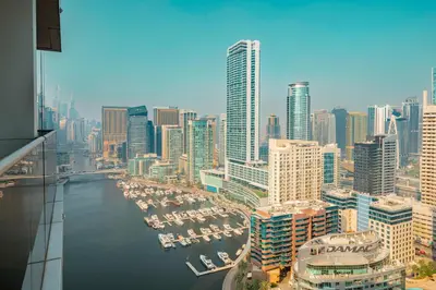 a view of a city with boats in the water at Prime Retreats - Sparkle Tower Marina in Dubai