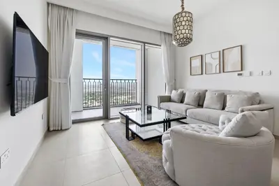 a living room with a couch and a table at 1BR with Park & Downtown Views plus Dubai Frame in Dubai