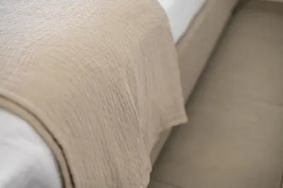 a close up of the arm of a couch at 1BR with Park & Downtown Views plus Dubai Frame in Dubai